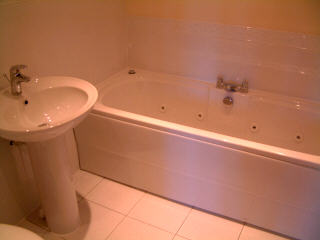 Bathroom with jacuzzi bath