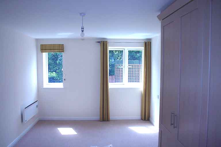 Bedroom 1 with fitted cupboards and en-suite