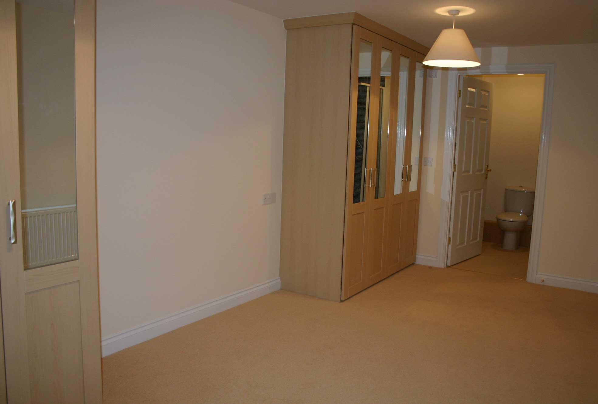 main bedroom with fitted wardrobes and en suite