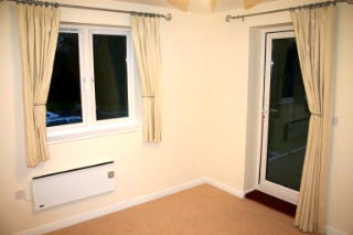 Bedroom 1showing door onto balcony